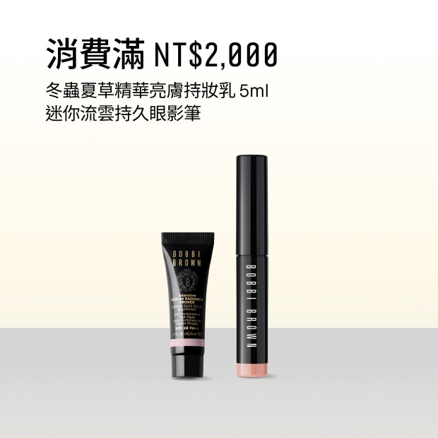 Close up of model eye showcasing defined brows and a natural, shimmery eye look